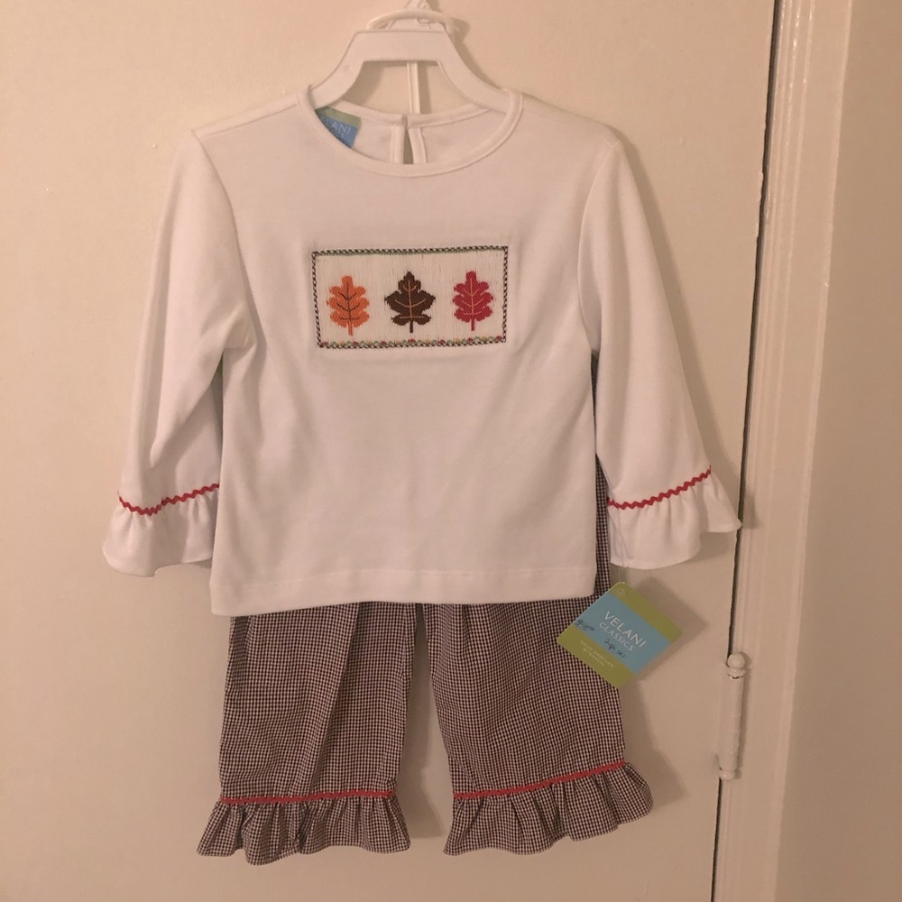 NWT hand smocked leave long sleeved top and pants.